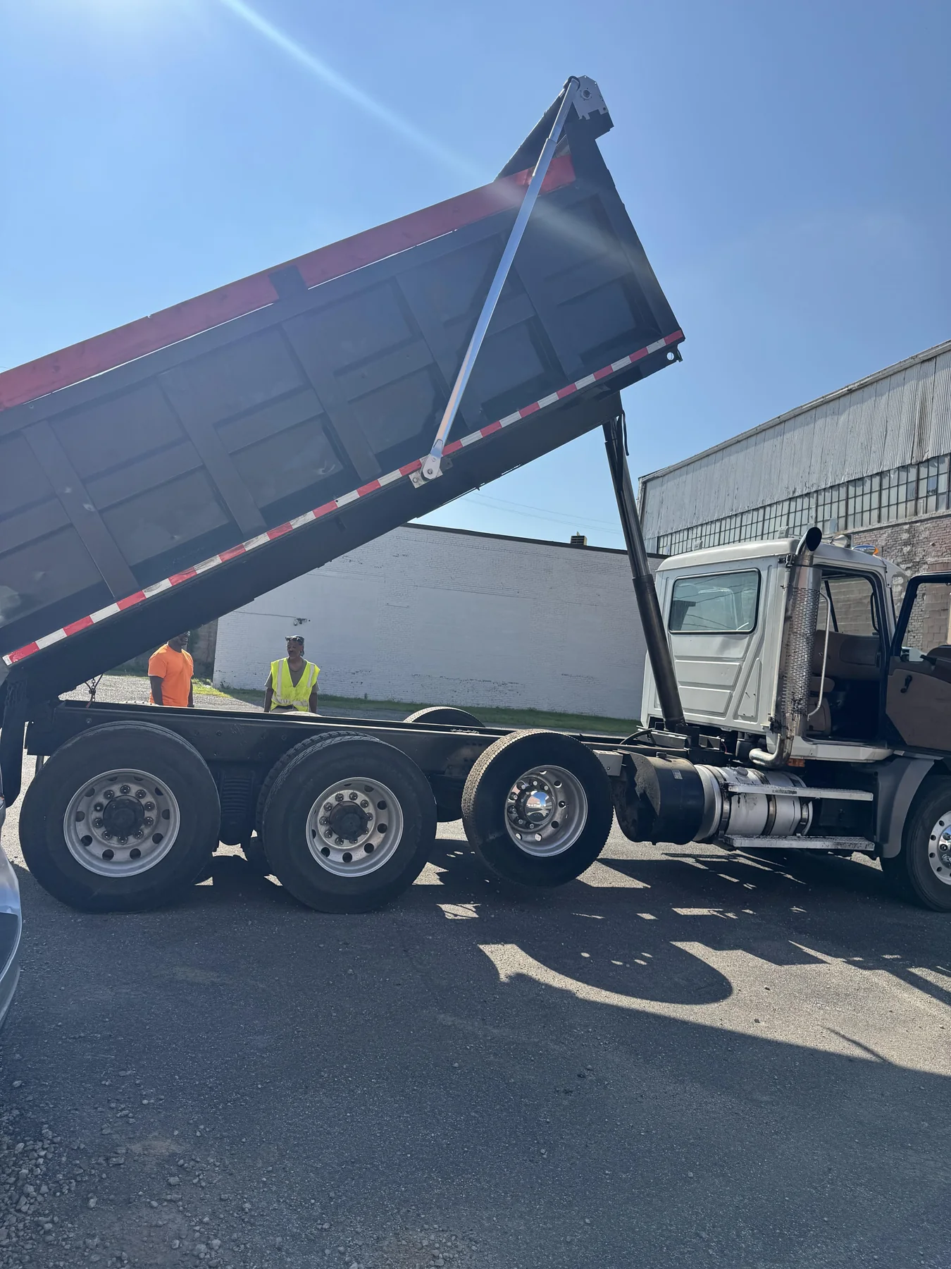 FatirGroup dump truck with its bed raised